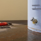 Close up of a leaking water heater on floor of residential property