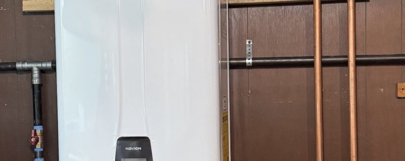 Fox Valley Plumbing technician performing on-demand water heater repair for an Elgin Illinois homeowner