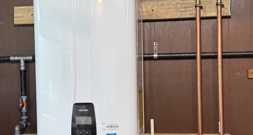 Fox Valley Plumbing technician performing on-demand water heater repair for an Elgin Illinois homeowner