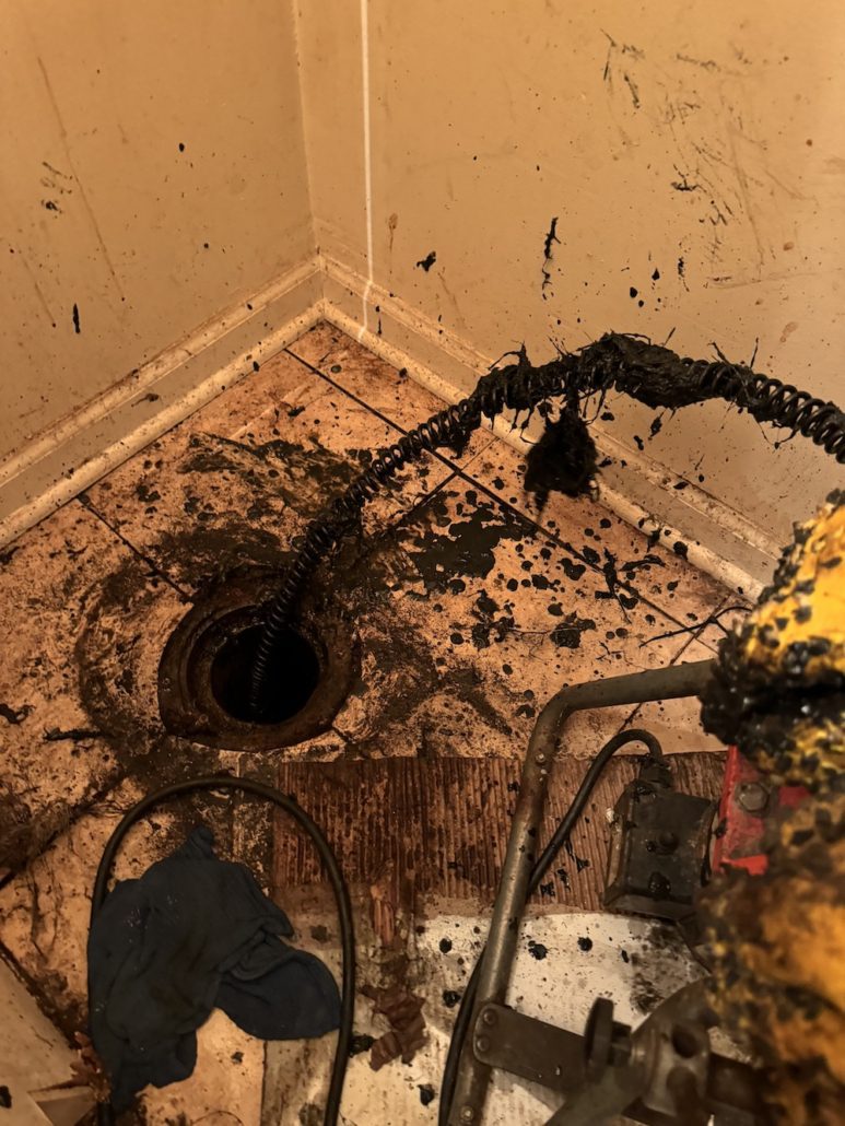 Plumber performing sewer line repair at a South Elgin home 