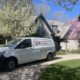 Plumber performing drain cleaning service in Elgin IL kitchen