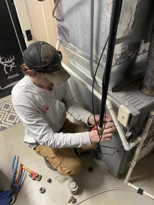 Licensed plumber answering homeowner questions about plumbing in Elgin IL