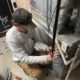 Licensed plumber answering homeowner questions about plumbing in Elgin IL