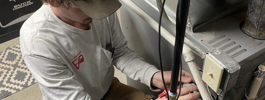 Licensed plumber answering homeowner questions about plumbing in Elgin IL