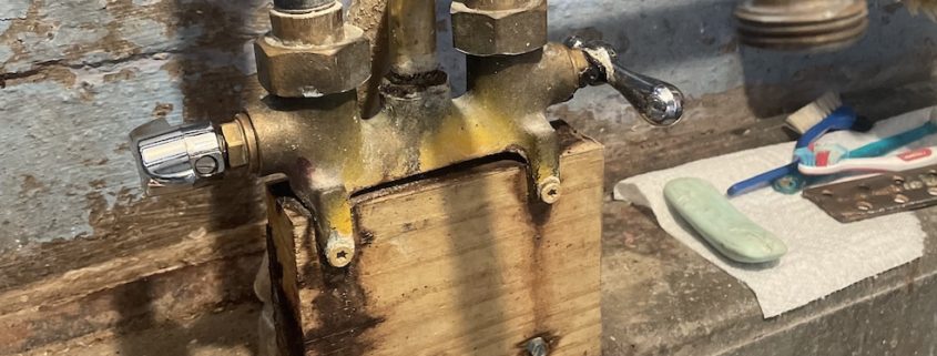 White mineral scale buildup on a kitchen faucet aerator in an Elgin, IL home